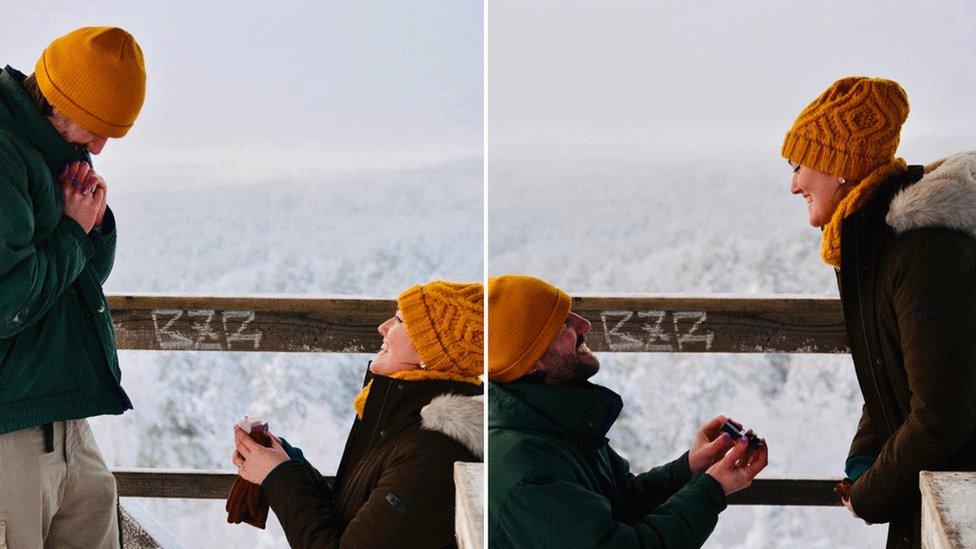 Bee Nichols, on one knee, proposing to James Kavanagh, and James on one knee proposing to Bee. Both are wearing yellow beanie hats