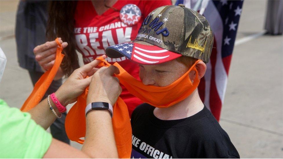 A child wearing a cloth face covering in Tulsa