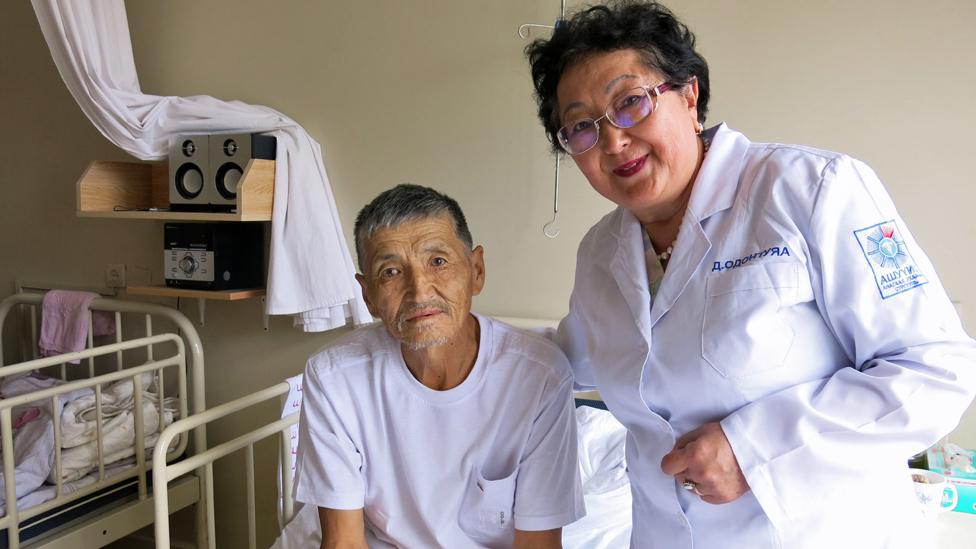 Davaasuren with Renchin, a patient at Mongolia's National Cancer Hospital