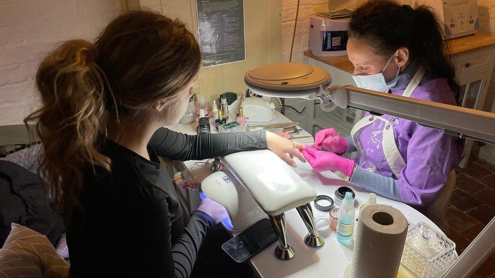 Nadiaa doing nail treatment