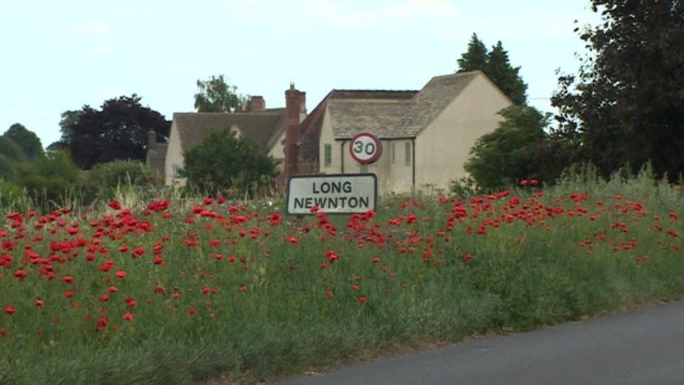 Long Newnton sign with 30mph sign next to it