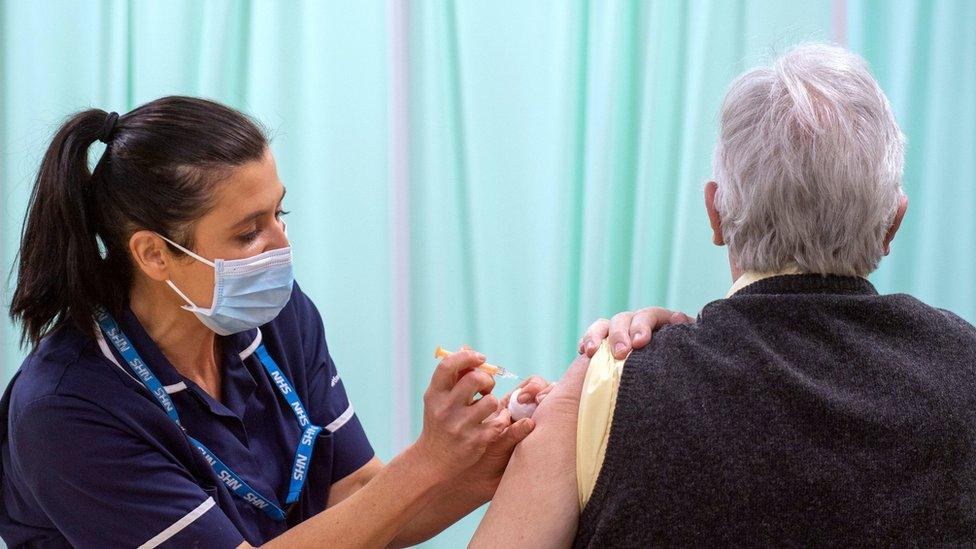 Woman receiving Covid jab in Stevenage