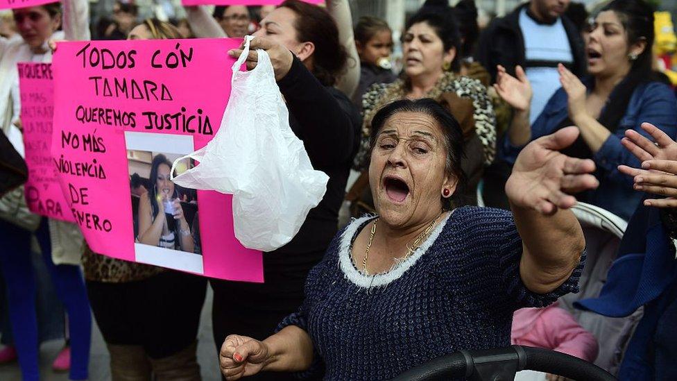 Gypsy community members hold placards reading, 'Justice for Tamara', during a protest to mark the death of Tamara Simon Barrul and against domestic violence, in Madrid on 10 April 2015