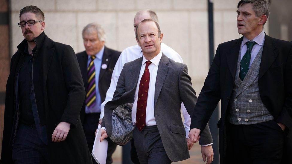 Henry Bolton (centre) arrives for the meeting which will decide his future