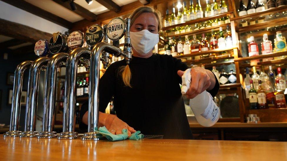 Felicity Bell cleaning a bar top