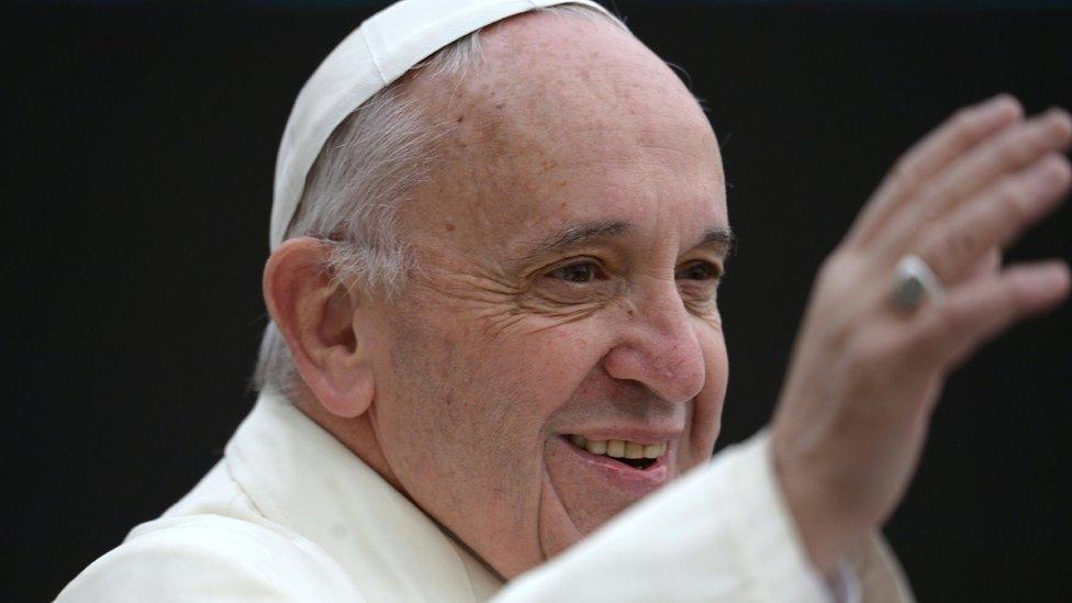 Pope Francis salutes crowd in St Peter's Square, Rome, for weekly general audience. 23 March 2016