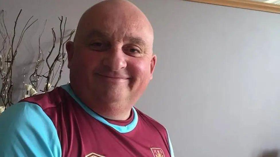 A picture of Mick Ferris in a West Ham T-shirt. 