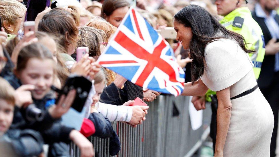 Meghan says hello to local schoolchildren