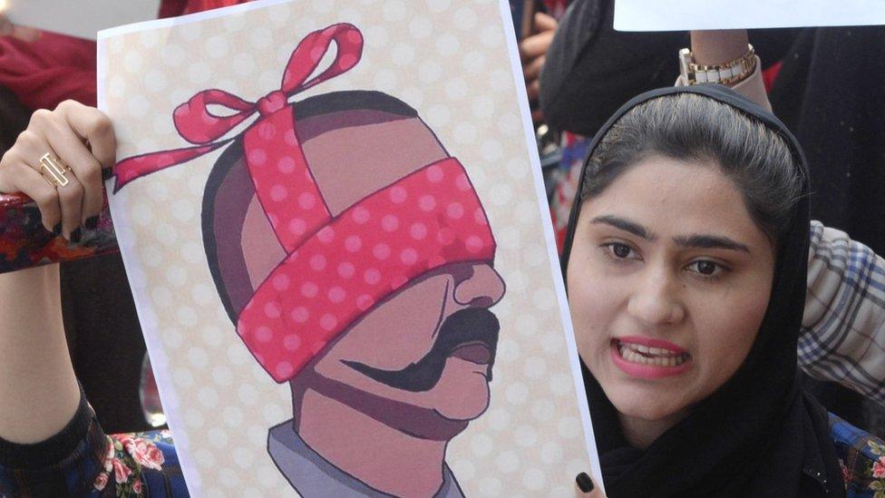 People hold depiction of captured Indian Air Force Pilot Wing Commander Abhinandan, as they shout anti-India slogans during a protest in Lahore, Pakistan, 28 February 2019.