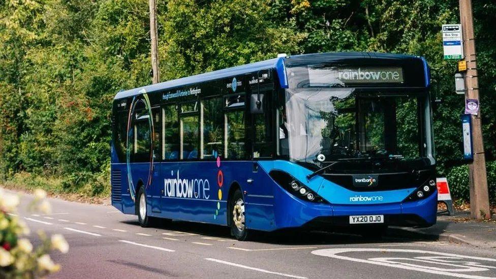 A bus waiting at a rural bus stop