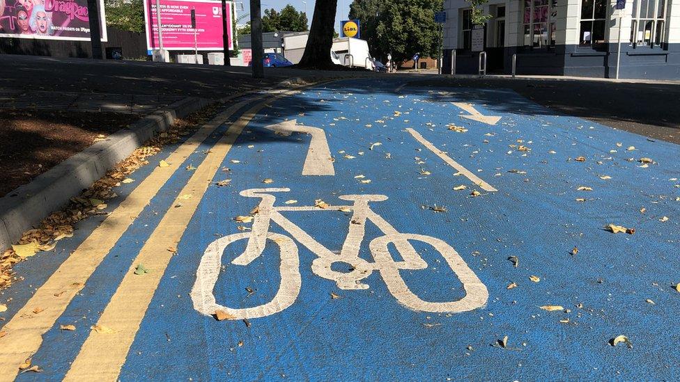 Bike painted on a blue cycle lane