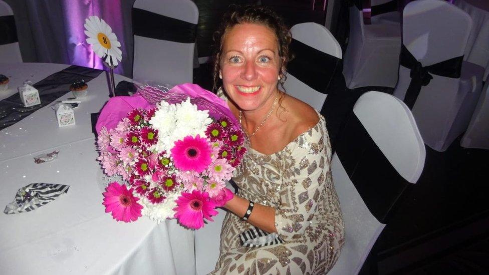 Sarah Griffiths at the school prom with the flowers she was given.