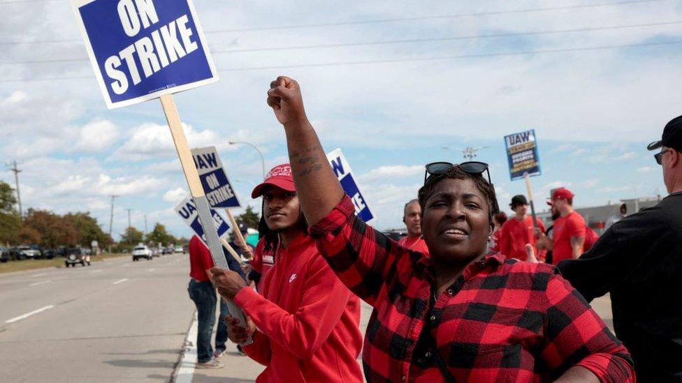 Striking United Auto Workers member Candis Holmes pickets outside the Ford Michigan Assembly Plant in Wayne, Michigan U.S., September 19, 2023.