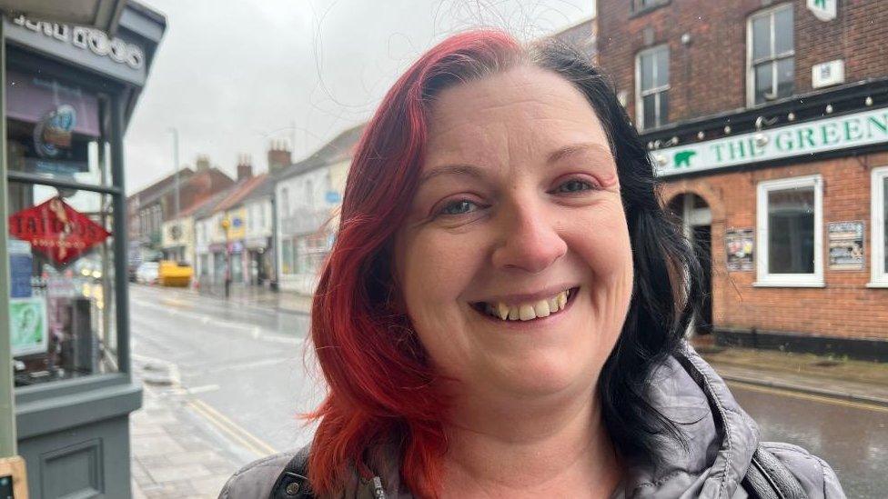 Joleen Azevedo standing outside the East Coast Hospice charity shop in Gorleston