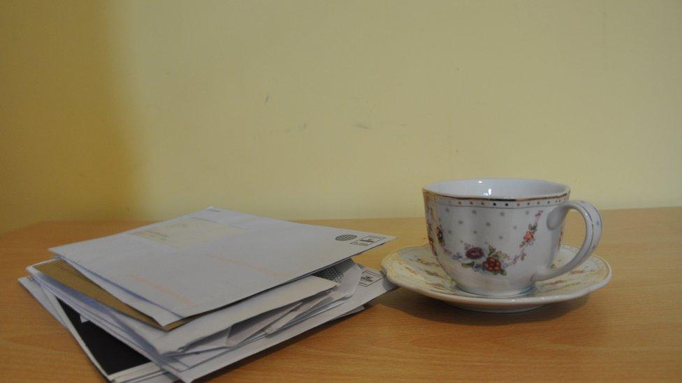 Cup of tea and pile of letters