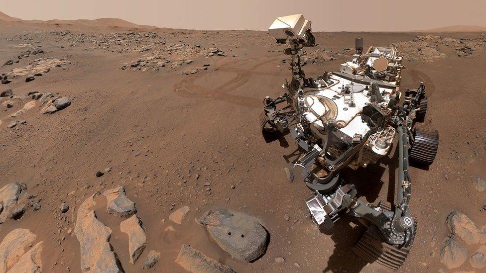 The Perseverance rover on the red rocky surface of Mars