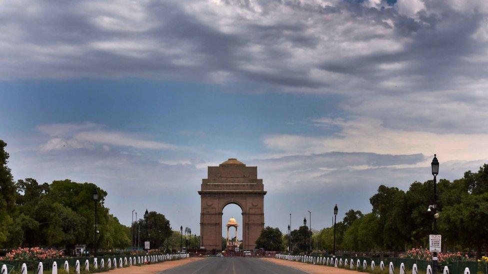 Clouds hover over the blue sky at India Gate during the lockdown to limit the coronavirus on April 20, 2020 in New Delhi, India.