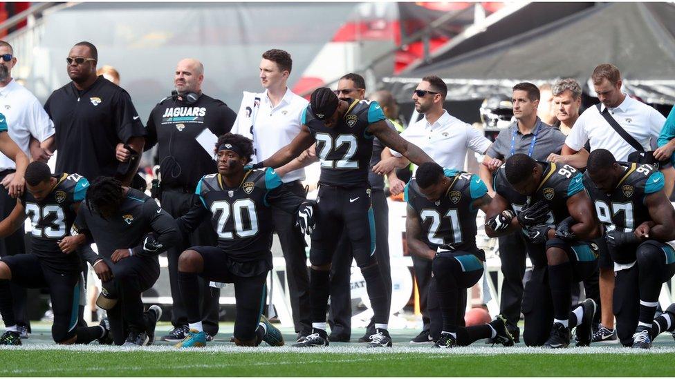 Members of the Jacksonville Jaguars kneel in protest during the national anthem at Wembley Stadium, London