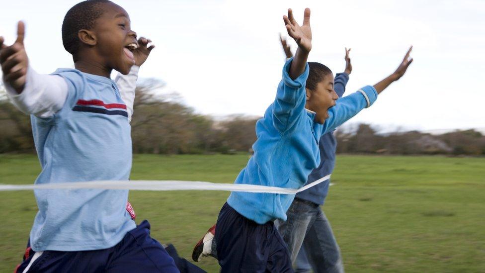 3 young boys take part in a race