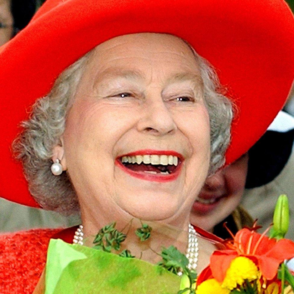 Queen Elizabeth II enjoying a walkabout after visiting the Old Government House in Fredericton, New Brunswick during her two-week royal visit to Canada.