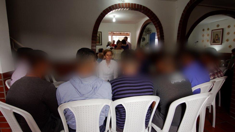 A group of defectors, with their faces blurred, speaking to the BBC