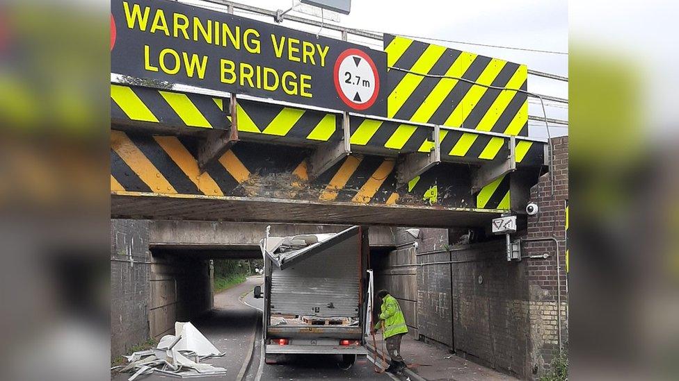 Van under bridge