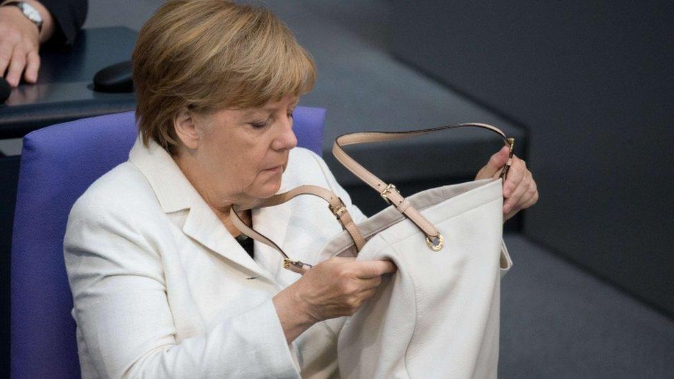 German Chancellor Angela Merkel attends a the parliament session at the opening of a debate on next year"s budget at the Bundestag