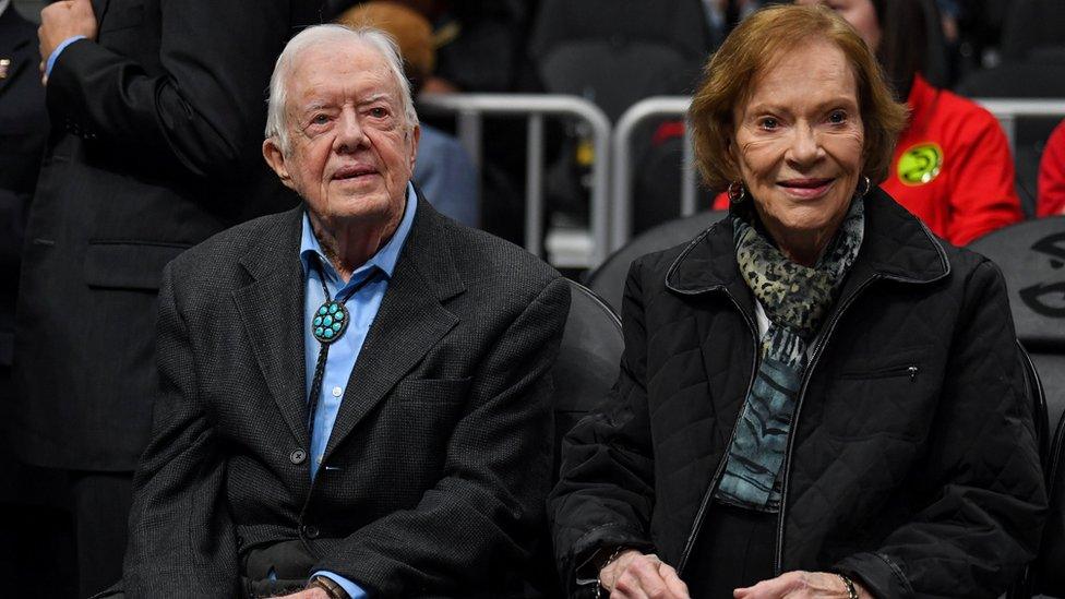 Former US President Jimmy Carter and his wife Rosalynn Carter attend at the game between the Atlanta Hawks and the New York Knicks at State Farm Arena