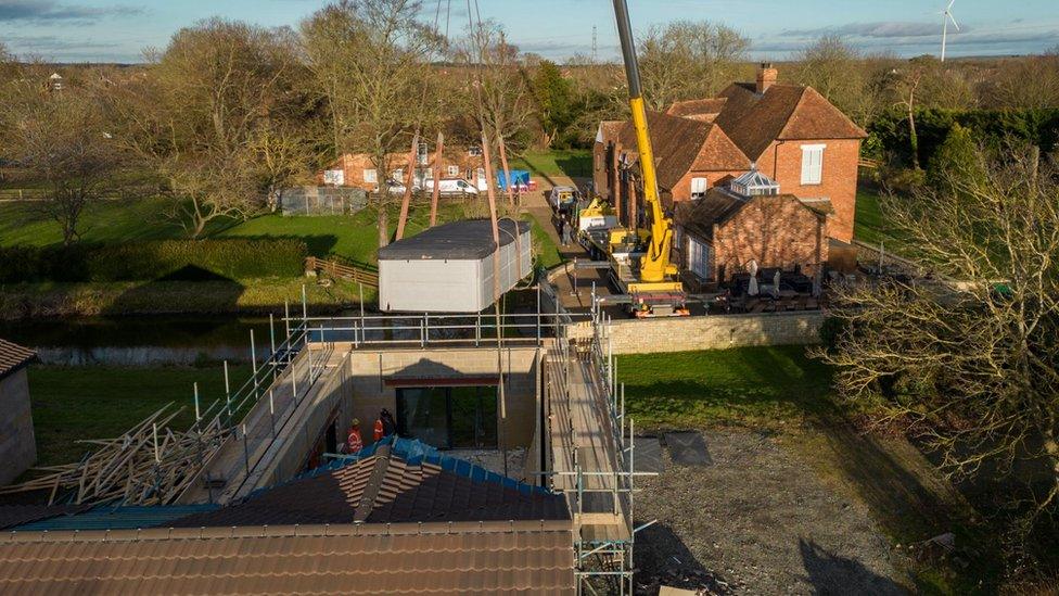 Spa pool lifted out by crane