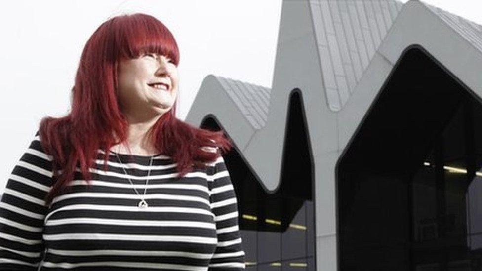 Izzy Conway, Glasgow 2018 volunteer champion pictured in front of the city's Riverside Museum