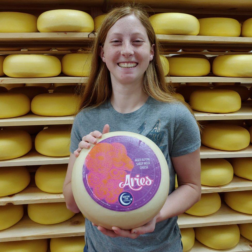 Avery Jones holding her award-winning cheese