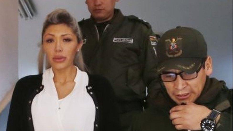 Gabriela Zapata is escorted by police from a court hearing after a judge ordered that she remain in custody and be transferred to a women's jail, in La Paz, Bolivia,