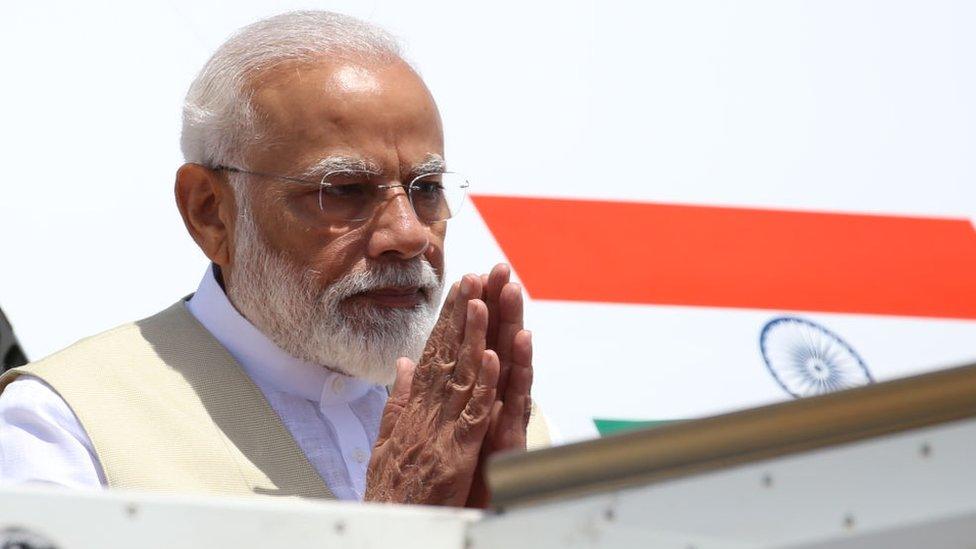 Prime Minister Narendra Modi acknowledges the reception as he arrives at in Sri Lanka on 9 June 2019.