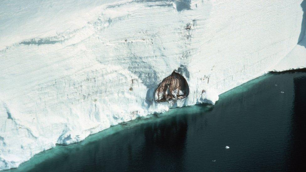 Halley III, the base where Peter Gibbs lived and worked, was abandoned in 1984. This image, from 1993, shows it crushed under the weight of snow accumulation and transported several miles to the coast by the moving ice shelf.