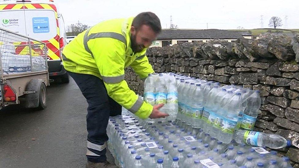 Bottled water being handed out in Shap