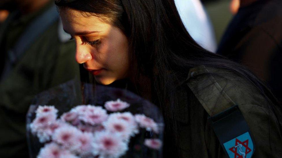 Israeli military medic at funeral of soldier killed in Gaza