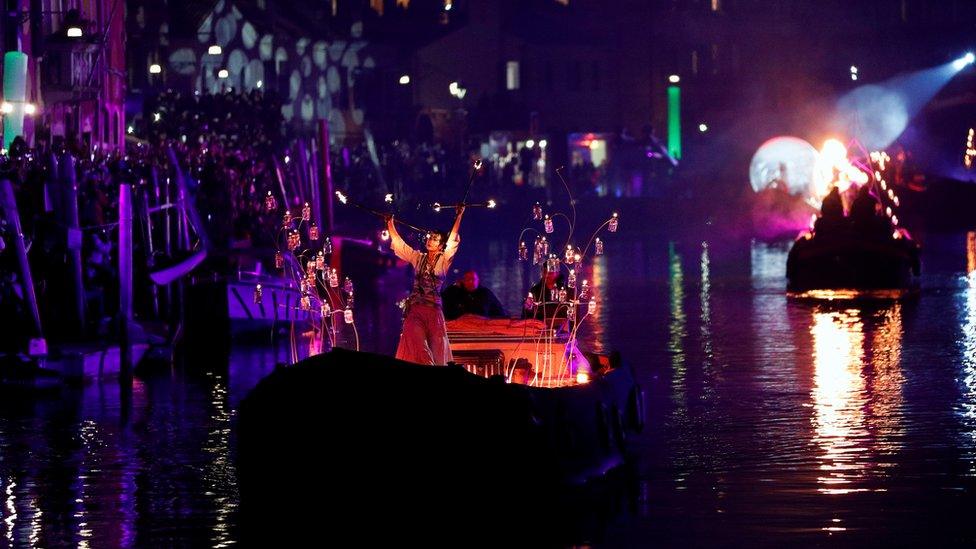 A dancer performs during a water parade marking the beginning of carnival season in Venice