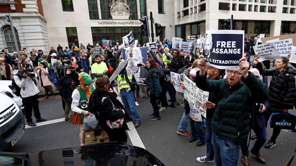 Demonstrators block traffic outside Westminster Magistrates' Court