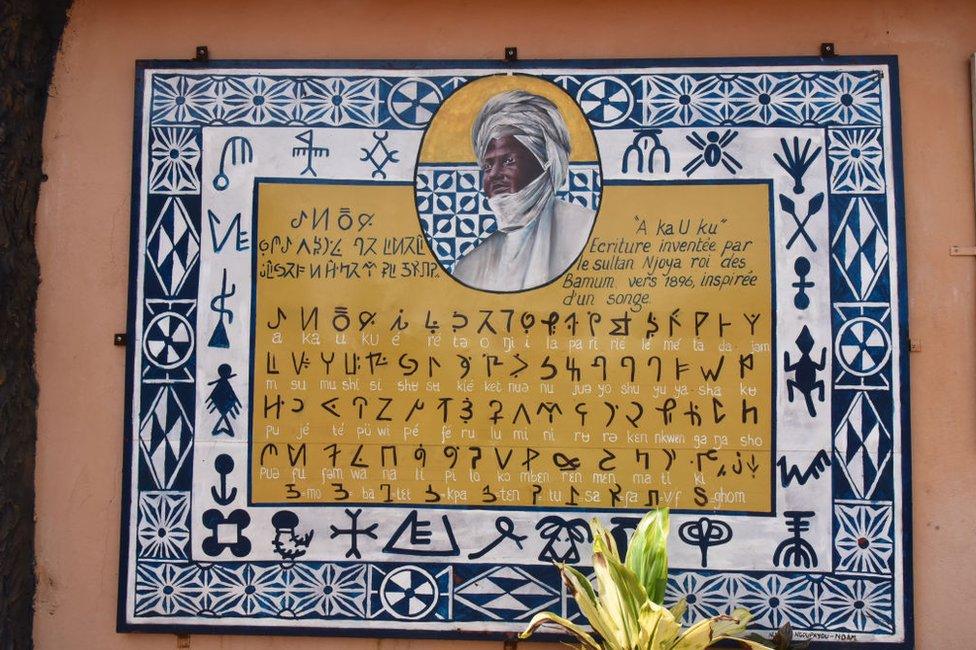 A plaque in Bamum script.