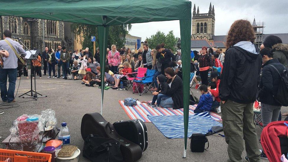 The congregation of Bethel Community Church held their Sunday service in the car park