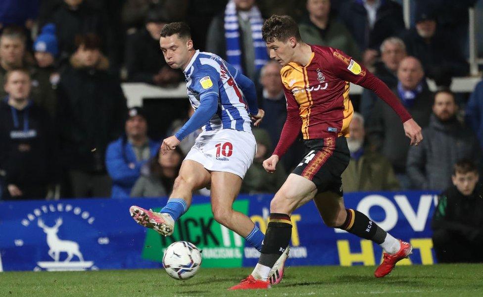 Luke Molyneux of Hartlepool United in action with Matty Foulds of Bradford City