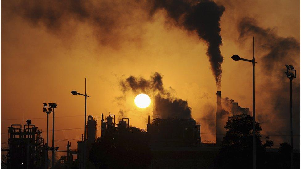 Smoke billows from chimneys at a chemical factory in Hefei, Anhui province