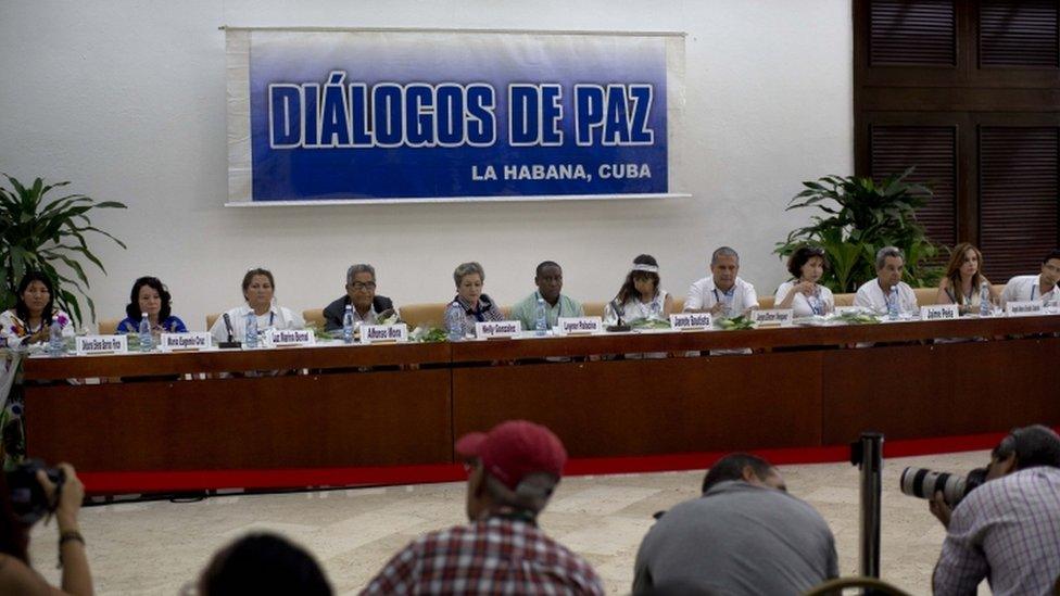 FILE - In this Aug. 16, 2014 file photo, victims of the Colombian armed conflict give a press conference after a meeting with the peace negotiation teams of the Revolutionary Armed Forces of Colombia (FARC) and Colombia"s government on the sidelines of peace talks in Havana, Cuba. Declaring that "peace is near," Colombia"s President Juan