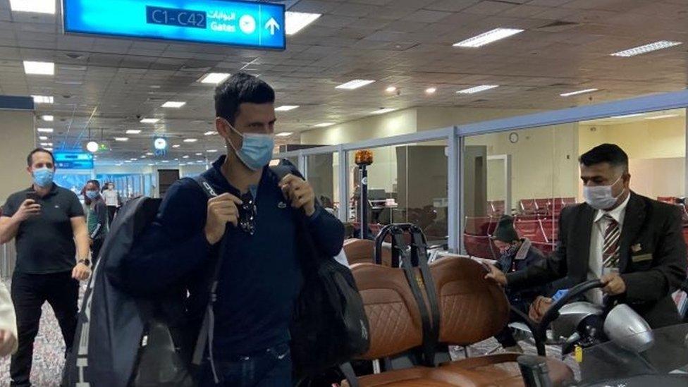 Novak Djokovic (centre) at Dubai's airport. Photo: 17 January 2022