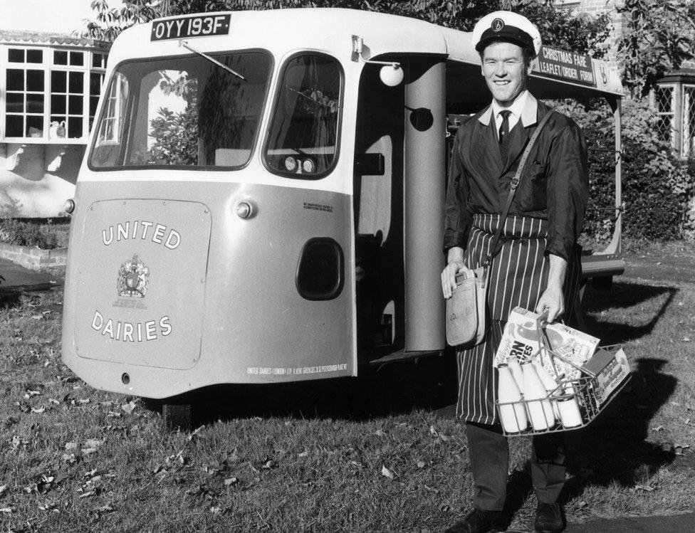 A milkman with his electric milk delivery float, 1972