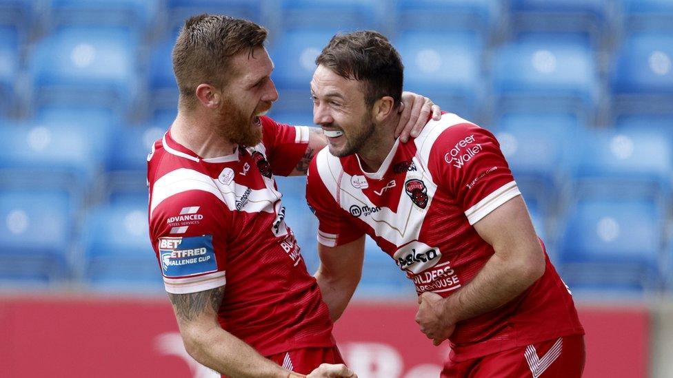 Salford Reds' Marc Sneyd and Ryan Brierley celebrate a try at the Salford Stadium