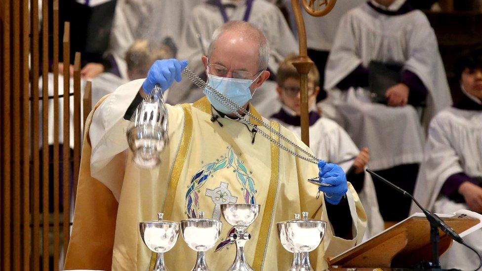 The Archbishop of Canterbury wearing protective clothing during the Christmas Day service at Canterbury Cathedral