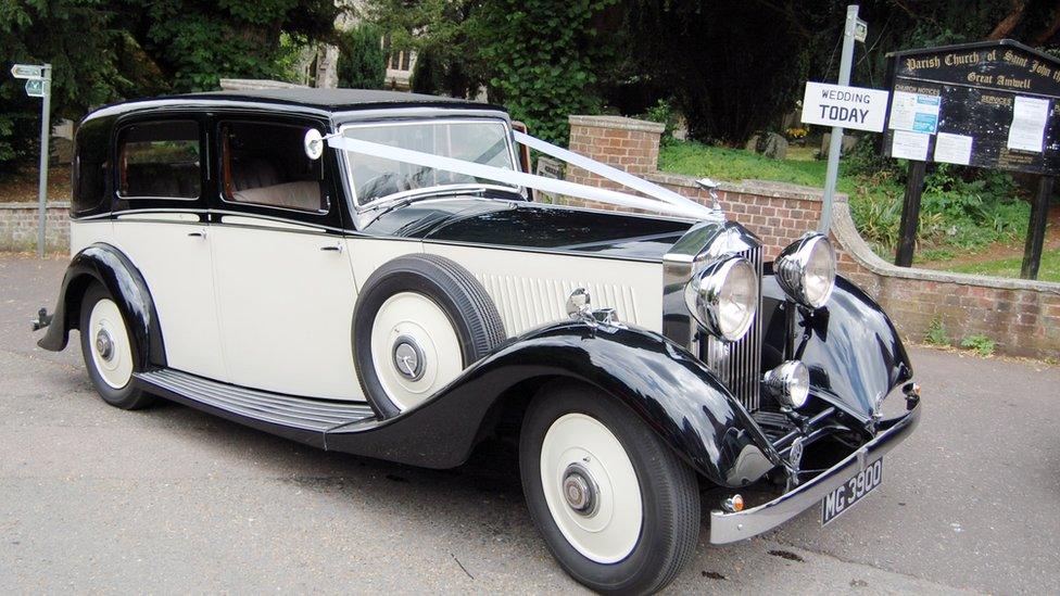 Rolls Royce vintage car with wedding ribbons