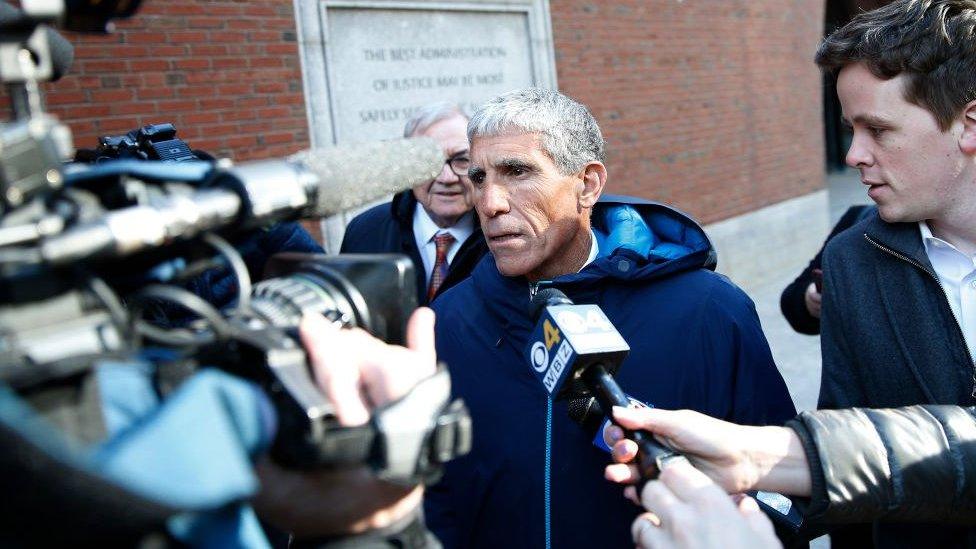 William Singer outside a Boston courthouse surrounded by media