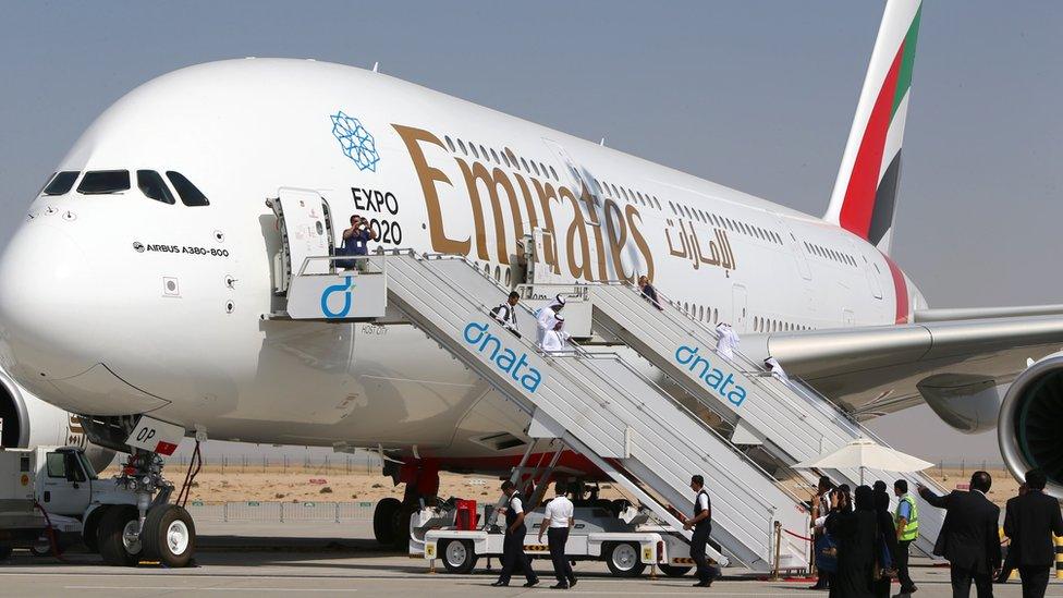 Visitors look at an Emirates airline's Airbus A380 at the Dubai Airshow, 9 Nov 2015